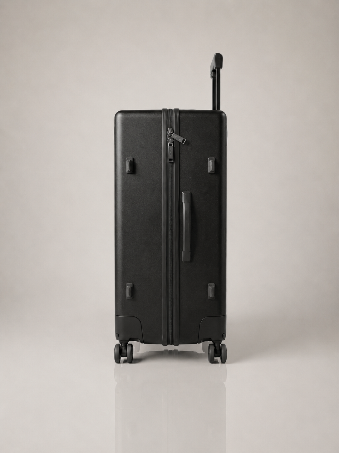 Trolley suitcase side bag holder securing a handbag while rolling